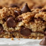 Macro close-up of zucchini bar texture with melted chocolate and zucchini strands.