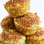 lemon poppyseed zucchini muffins on a cooling rack