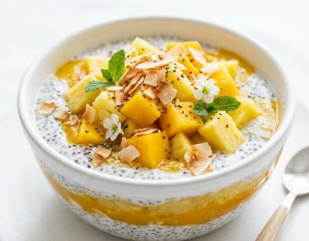 Tropical chia pudding breakfast bowl with mango, pineapple, and coconut