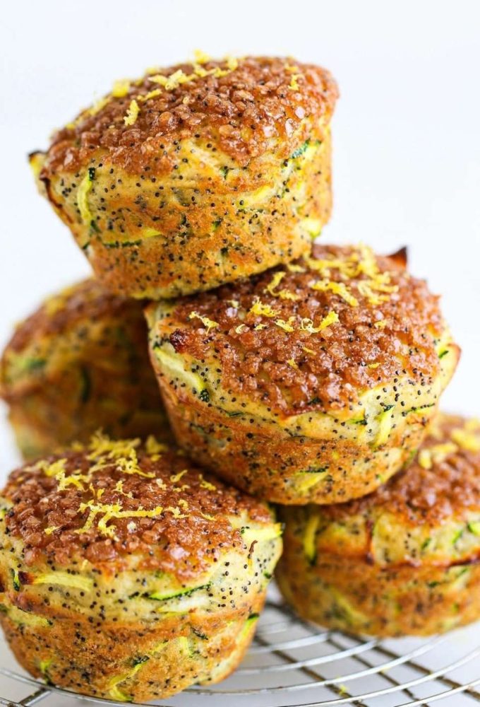 lemon poppyseed zucchini muffins on a cooling rack