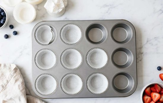 Lining a muffin tin with paper liners