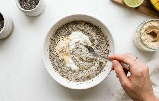 Stirring Greek yogurt and protein powder into chia mixture