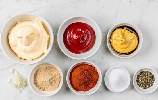 Step 1 of Classic Burger Sauce — all ingredients arranged on a white marble table in bright overhead natural light, horizontal food photography.