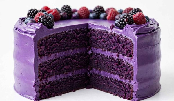 Purple velvet cake with a slice shown from the front
