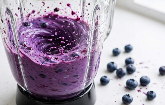 Blending fresh blueberries into a smooth puree.