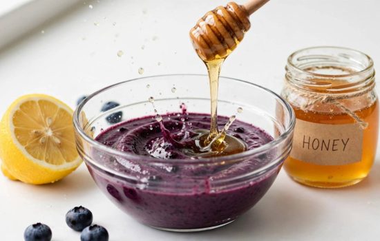 Adding honey and lemon juice to blueberry puree.