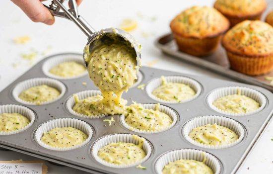 Filling muffin tin with lemon poppyseed zucchini batter