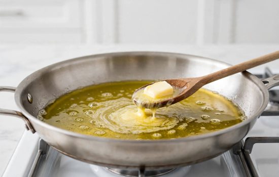 Skillet heating with olive oil and melting butter.